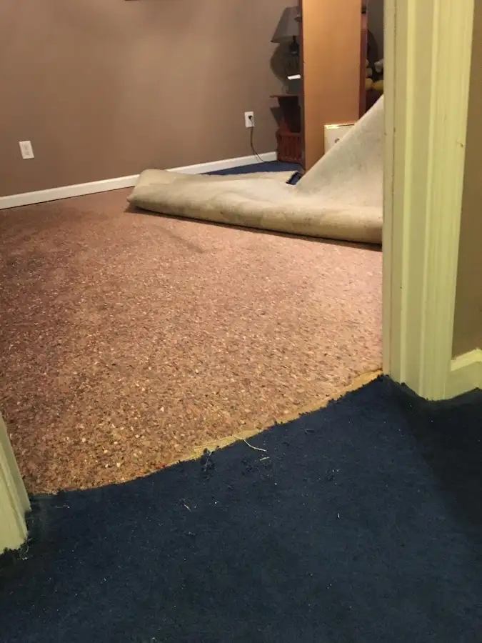 Carpet pad removal revealing water damage during Drying & Dehumidification in Weatherford